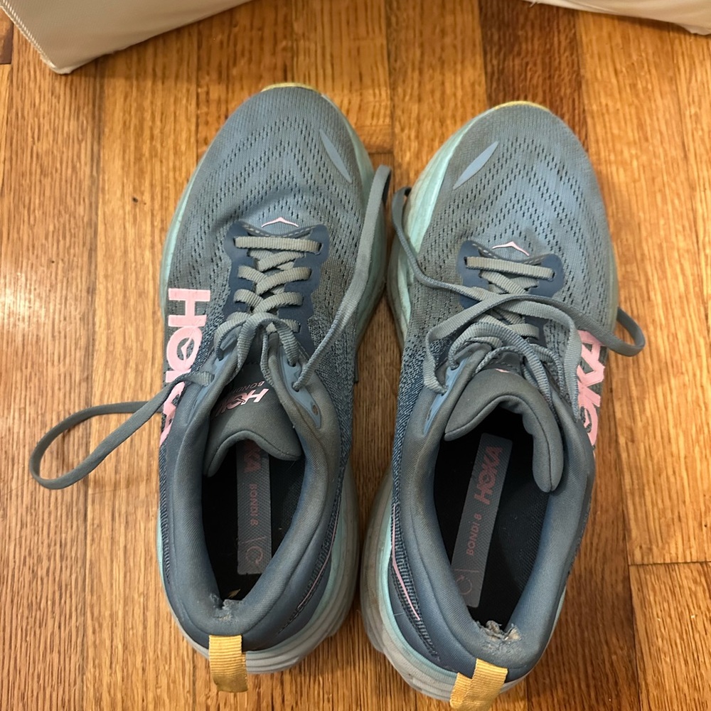 Hoka Women's Running Shoes in Teal with Pink Logo and Yellow Pull Tabs